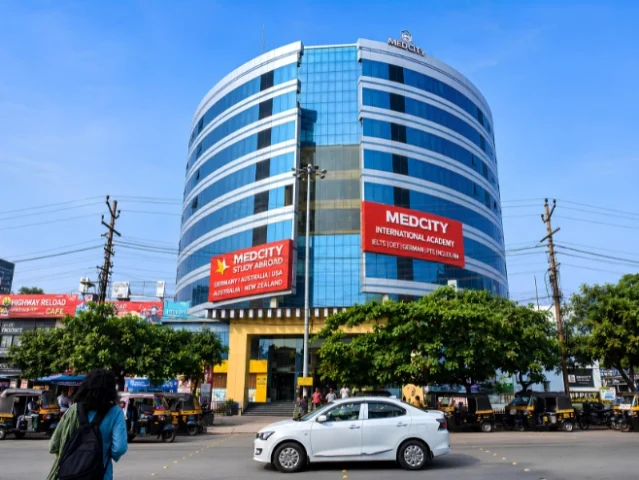 Exterior view of the Medcity International Academy Kozhikode branch in Kerala, offering study abroad counselling, German language training, IELTS, OET, PTE coaching, and overseas education services in a modern commercial building.